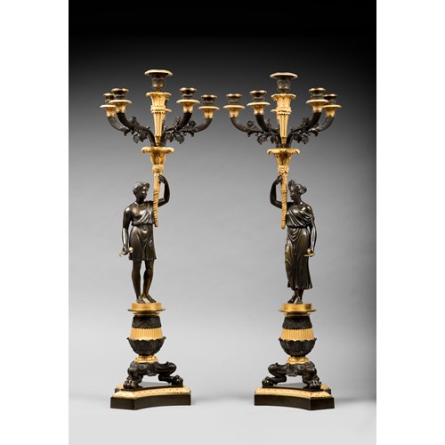 A pair of Empire ormolu and patinated bronze six-light candelabra